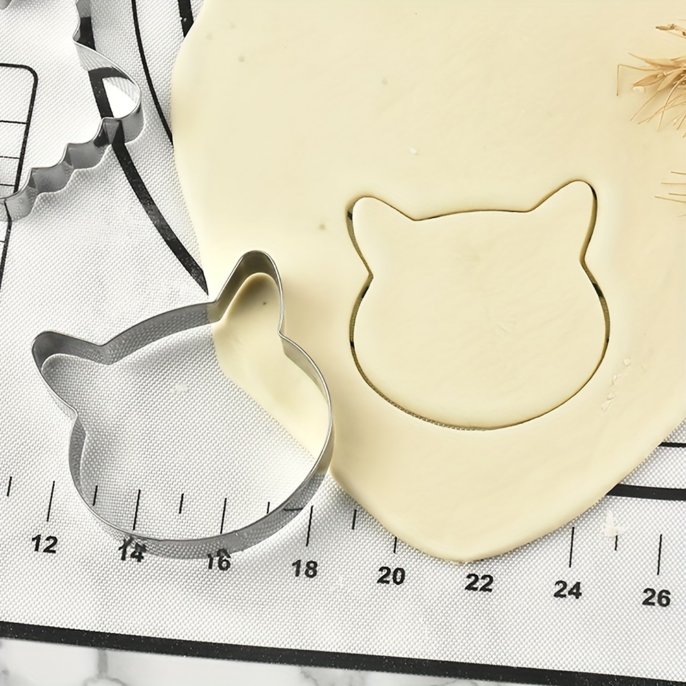 A Stainless Steel Cookie Cutter For Cartoon Cats